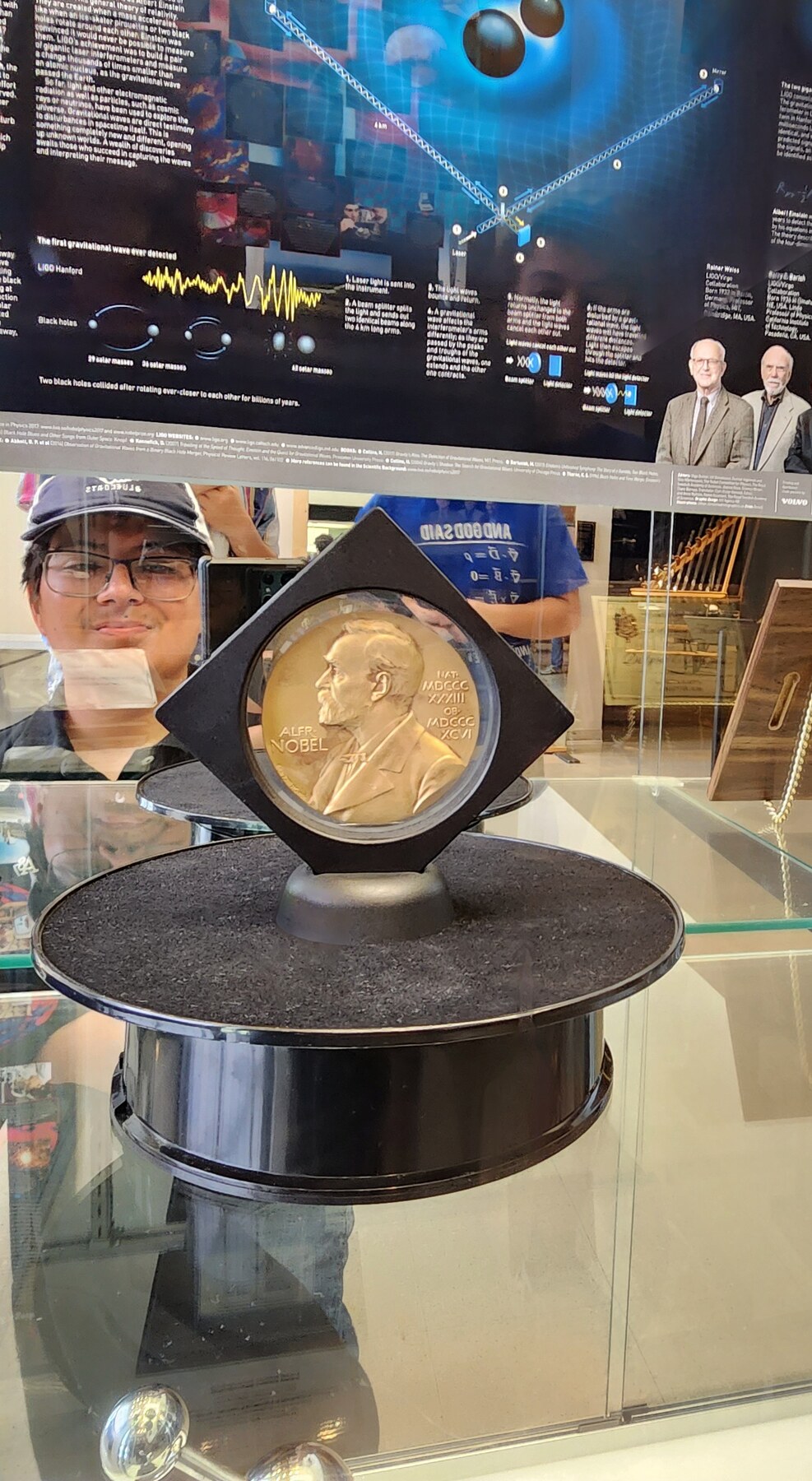 Alexander Mendoza viewing the LIGO Nobel Prize display