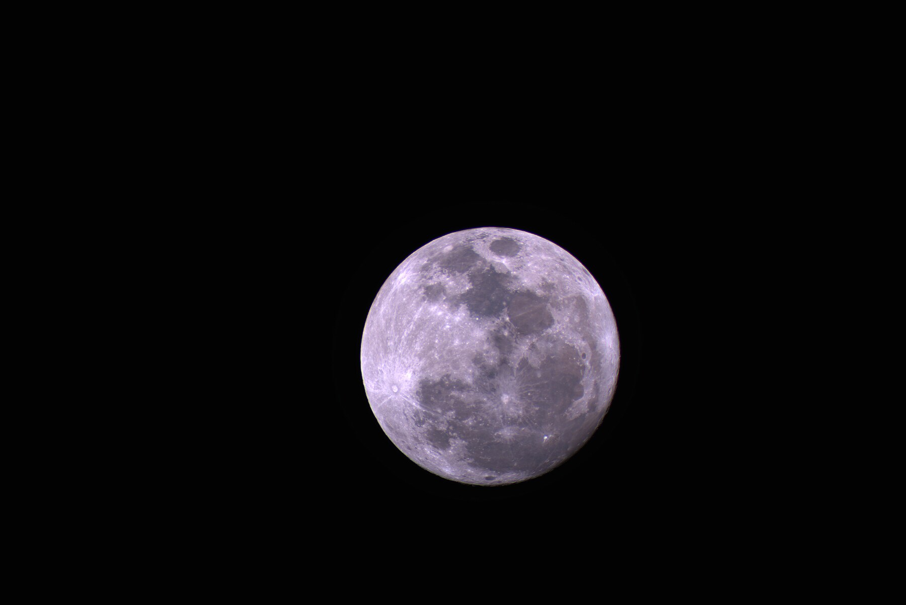 A detailed warm-toned portrait of the Strawberry Moon
